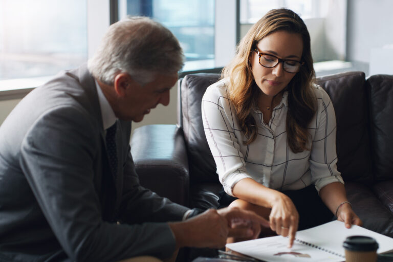 Attorney, paralegal and meeting in office with document, manager advice and feedback for evidence file. Lawyer, people and discussion in firm with lawsuit administration, paperwork and collaboration
